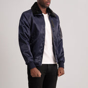 
Blue Satin Bomber Jacket - 展现肩线贴合与利落下摆的背部视角